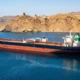Strait of Hormuz tanker stalled under Iranian coastal control 2026