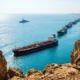 Strait of Hormuz tankers Omani route Iran control shift 2026